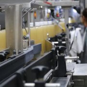 A row of Pure-Castile Liquid Soap on a conveyor belt